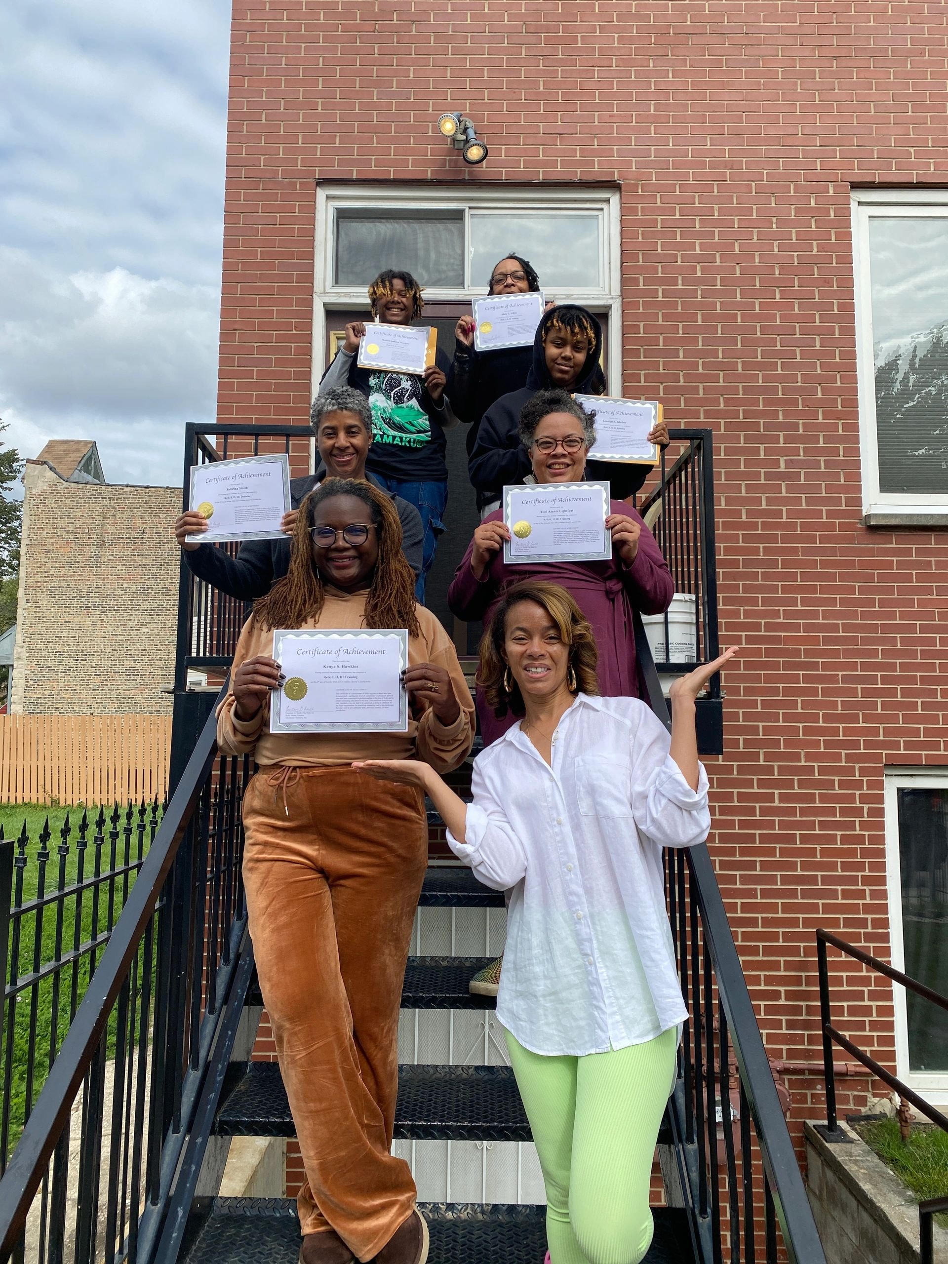 Sister Circle Reiki graduation — group holding certificates